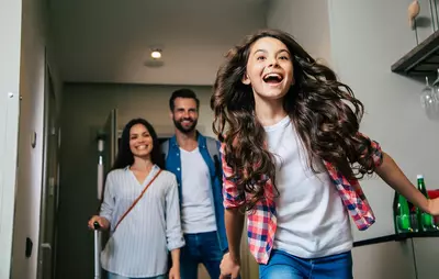 Family entering hotel room